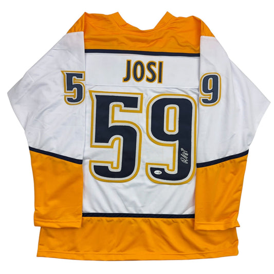 White and gold Nashville Predators hockey jersey with number 59 and "JOSI" nameplate, displayed flat against white background showing back view.