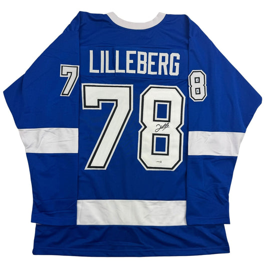 Back view of blue and white striped hockey jersey with "LILLEBERG" and numbers "7" and "78" in white lettering.