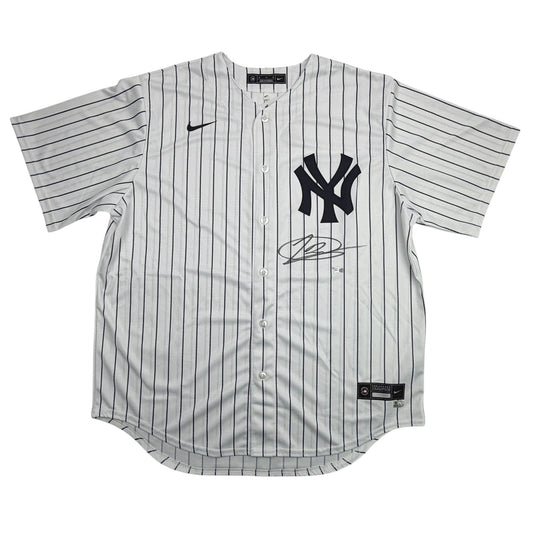 White pinstriped Yankees jersey with black NY logo and autograph, displayed flat against white background, front view.