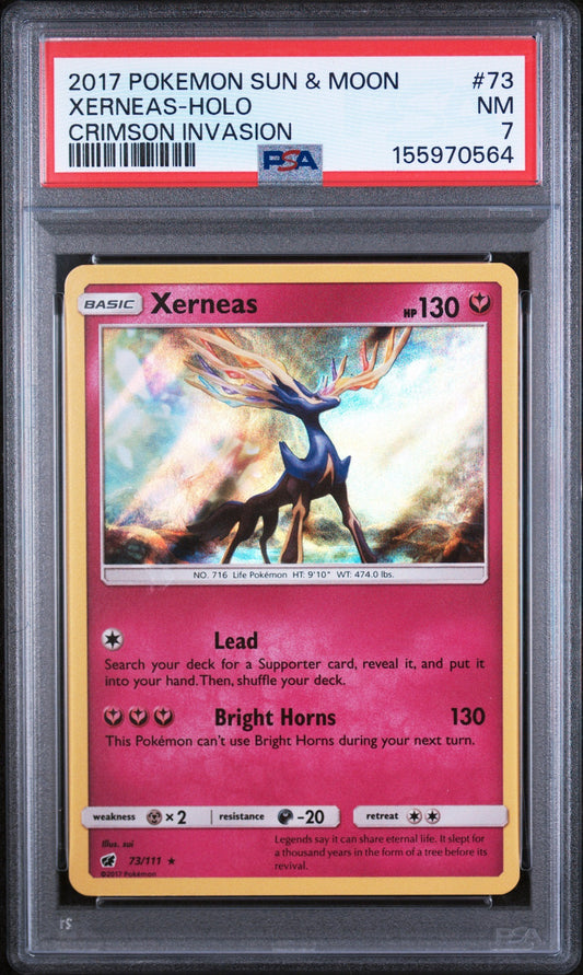 PSA-graded Xerneas Pokémon trading card in protective case, showing pink card front with gold borders and blue deer illustration.