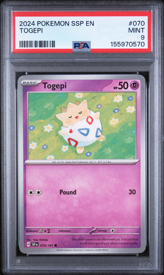 PSA-graded Togepi Basic Pokémon card in protective slab showing pink card back with move details and Pokédex information.