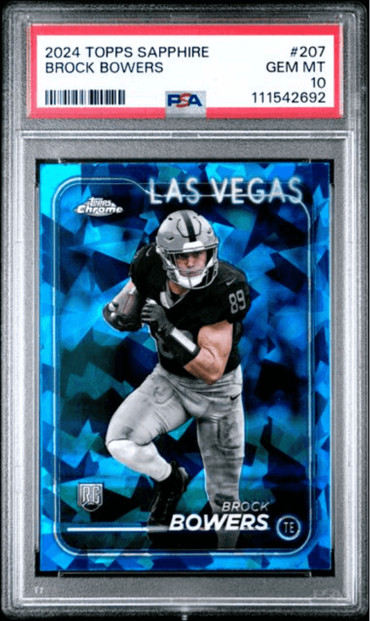 PSA-graded trading card in clear plastic case showing Brock Bowers in Las Vegas Raiders uniform on blue holographic background with rookie logo.