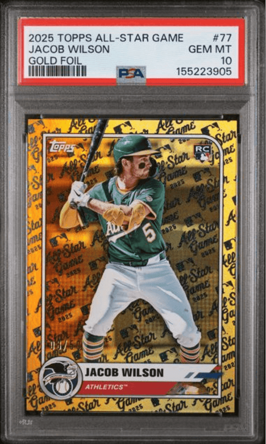 PSA-graded card in clear plastic holder showing Jacob Wilson batting in green Athletics uniform against gold foil background with yellow border.