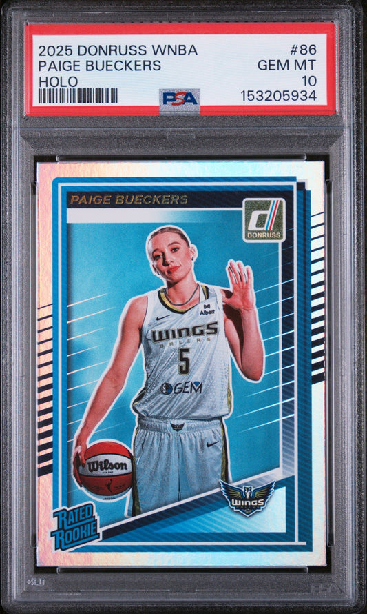 PSA-graded trading card in plastic case displaying Paige Bueckers in Dallas Wings uniform holding basketball against blue background.