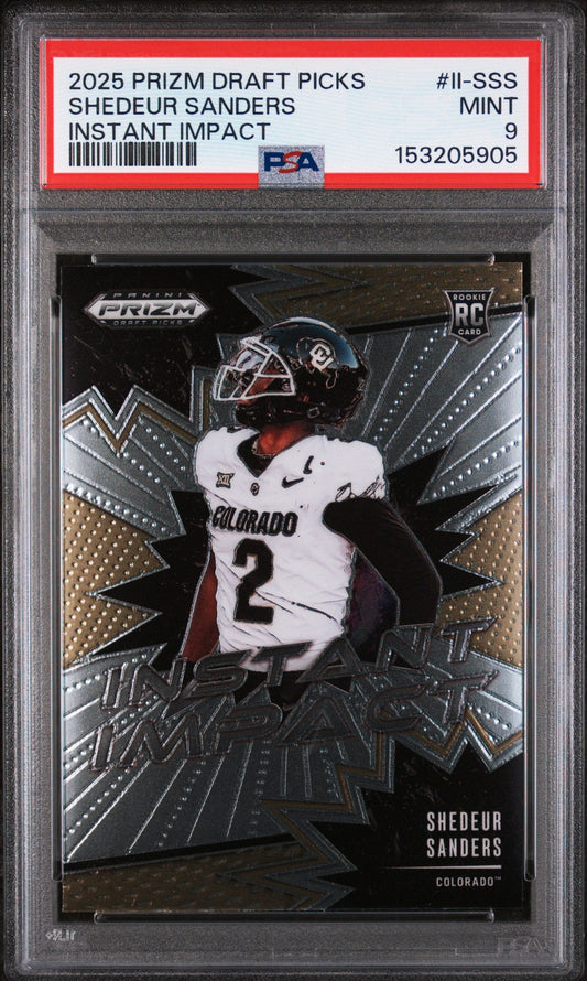 PSA-graded Shedeur Sanders rookie card in protective case showing front design with player in white Colorado uniform against metallic starburst background.
