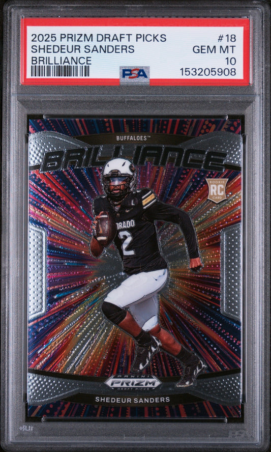 Front of graded PSA 10 card showing Shedeur Sanders in black Colorado uniform on holographic red and blue background with "Brilliance" text visible.