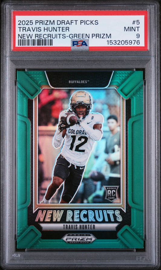 Graded sports card in clear plastic case displaying Travis Hunter in Colorado uniform with green Prizm border and PSA grading label.