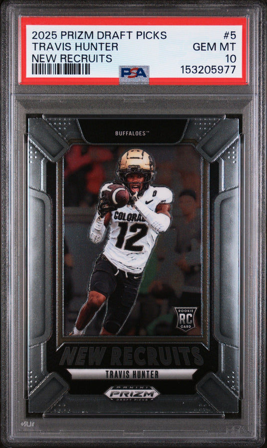 PSA-graded trading card in clear case showing Travis Hunter in Colorado uniform catching football, with red label strip and grading details visible at top.