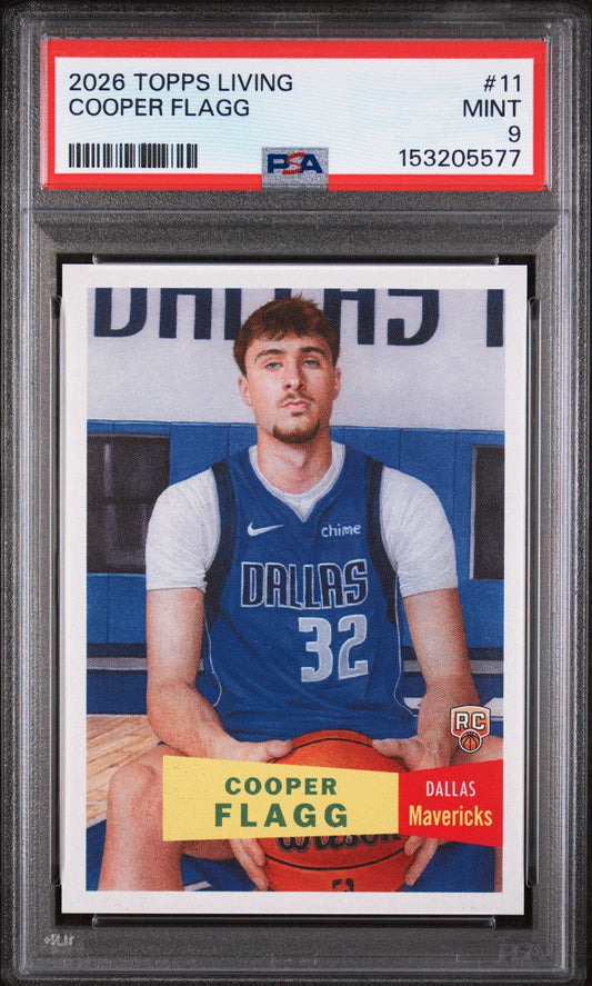 PSA graded card in clear holder showing Cooper Flagg in Dallas Mavericks blue jersey number 32, with red and yellow label banner below.