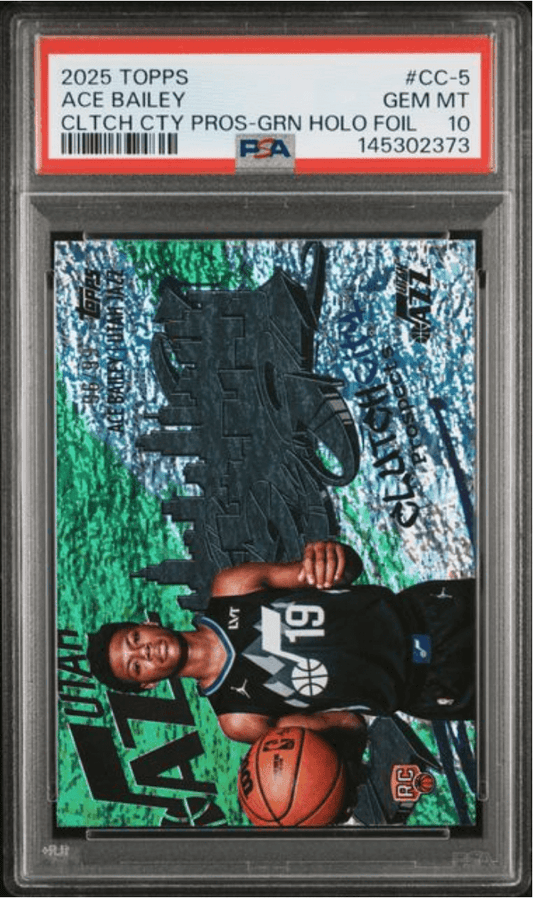 PSA-graded sports card in clear case showing rookie basketball player in black uniform holding orange ball against green and blue stadium background.