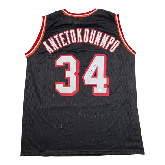 Back view of black mesh basketball jersey numbered 34 with red and white lettering reading "ANTETOKOUNMPO" and red and gold trim.
