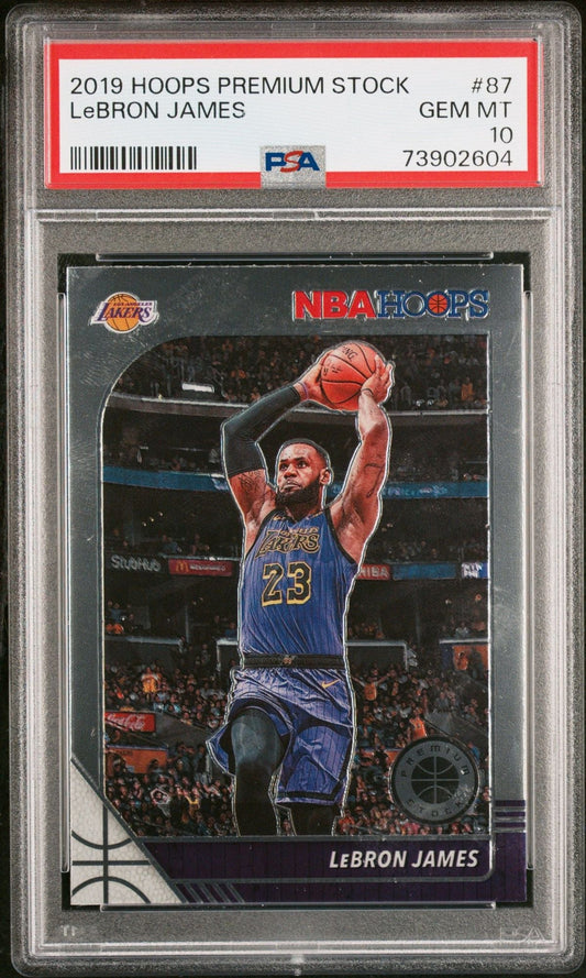 PSA-graded LeBron James basketball card in clear plastic case showing player shooting basketball in Lakers jersey with red label strip at top.