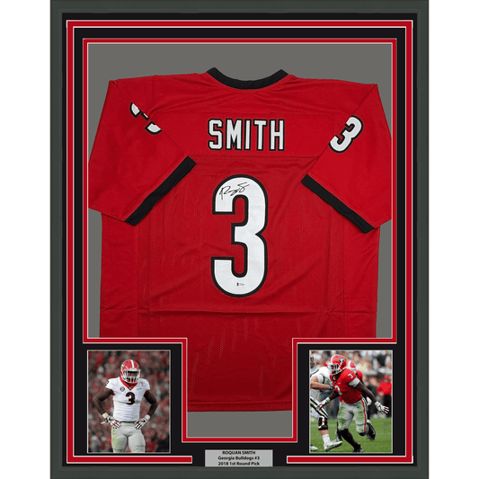 Framed red Georgia Bulldogs #3 jersey signed by Roquan Smith, displayed with two action photos and nameplate below.