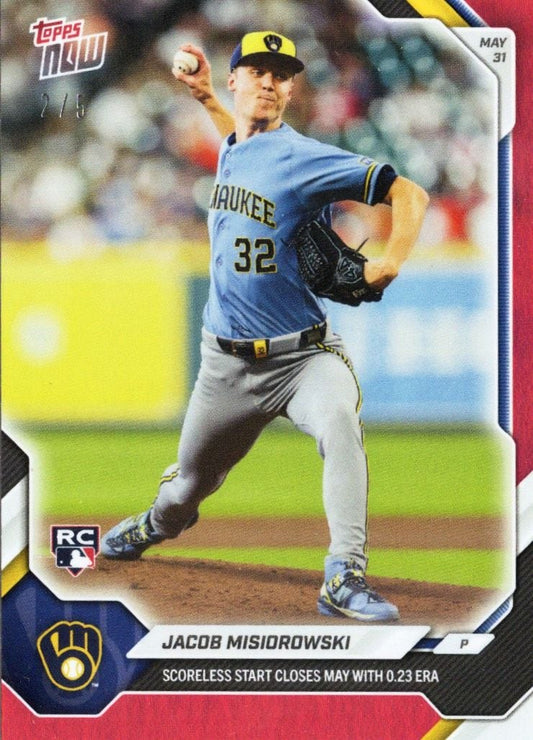 Pitcher Jacob Misiorowski in blue Brewers uniform mid-delivery, card front showing number 32, RC logo, and stat text on red foil background.