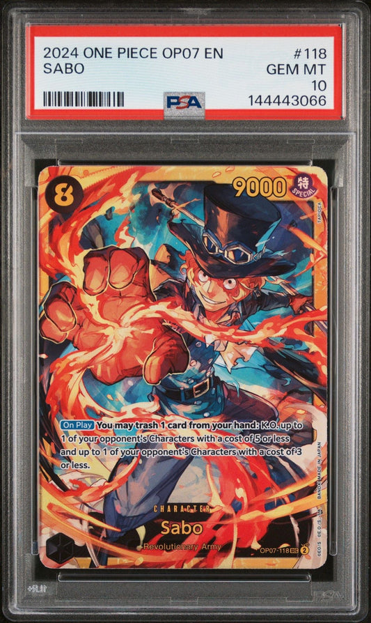 PSA-graded One Piece Sabo card in protective slab, showing colorful artwork of character with red flames and blue clothing against black case background.