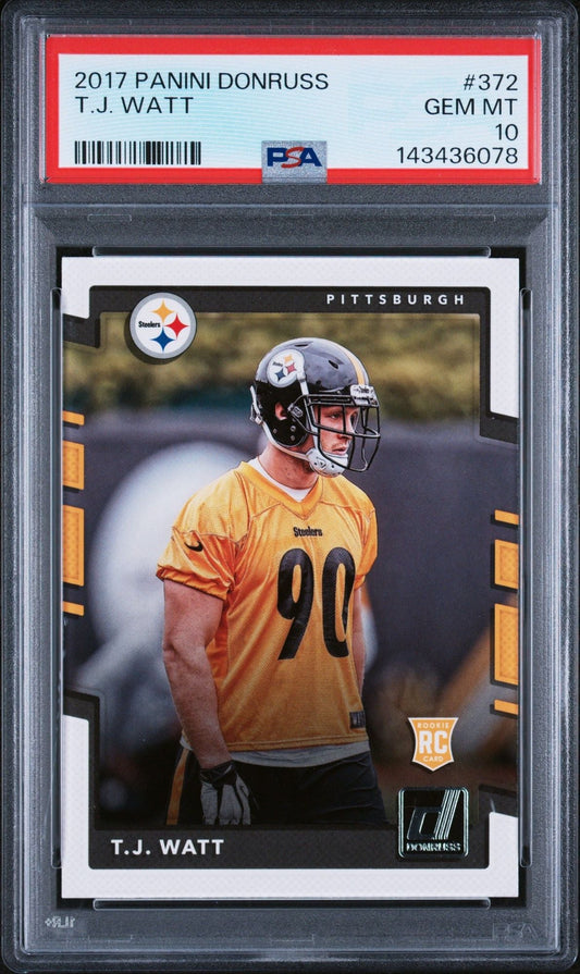 PSA-graded 2017 Panini Donruss T.J. Watt rookie card in protective holder, showing player in yellow Steelers jersey number 99.