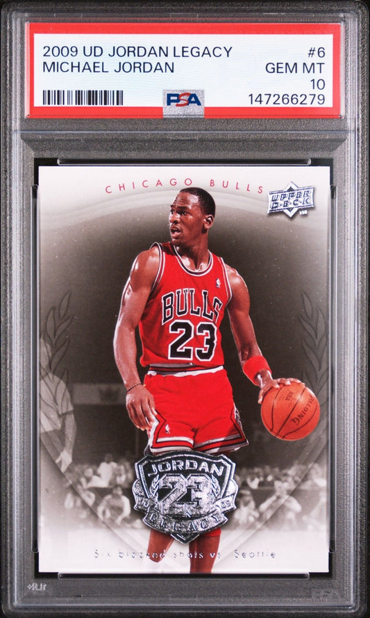 PSA-graded 2009 UD Jordan Legacy card #6 in plastic slab showing Michael Jordan in red Bulls jersey number 23 dribbling basketball.