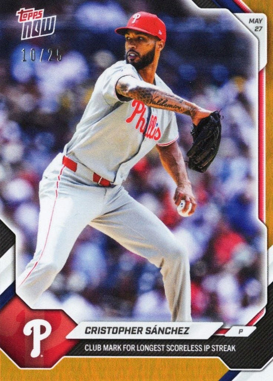 Philadelphia Phillies pitcher Christopher Sánchez mid-delivery in gray uniform with red helmet on orange foil baseball card.