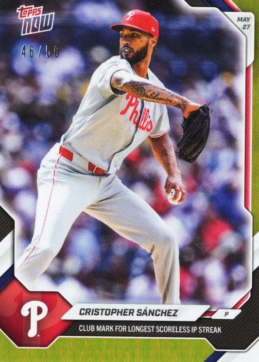Philadelphia Phillies pitcher Christopher Sánchez mid-delivery in white uniform and red cap on Topps Now baseball card with gold foil finish.