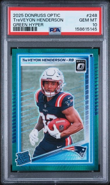 PSA-graded trading card in clear case displaying TreVeyon Henderson in New England Patriots uniform holding football.
