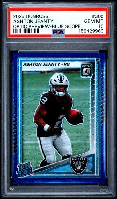 PSA-graded trading card in protective case showing Ashton Jeanty rookie card with blue border and Raiders logo on white background.