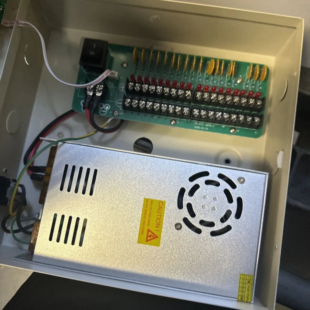18 channel power supply silver unit with circular vent and caution label