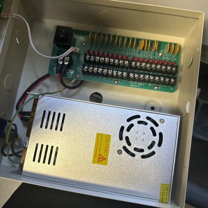 18 channel power supply silver unit with circular vent and caution label