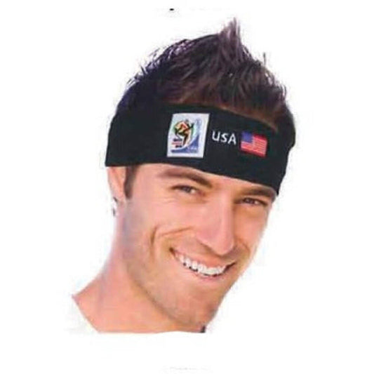 Man wearing black FIFA World Cup headband with USA flag and logo, smiling at camera against white background.