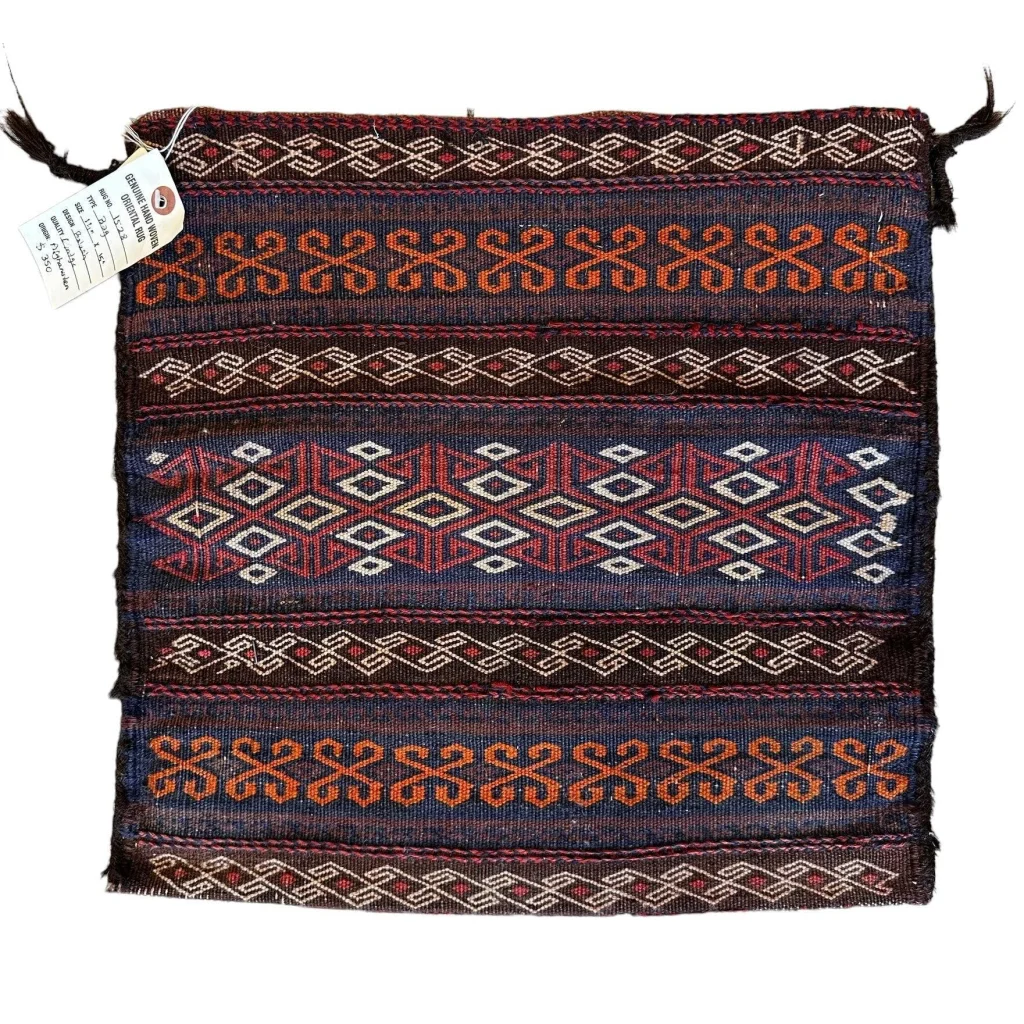 1900s Qashqai tribal bag from Persia, detail of geometric field motifs, natural wool and plant-based dyes