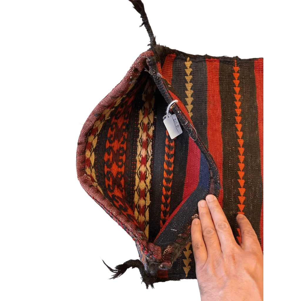 Antique Qashqai bag face 1900s, showing intact closures and worn nomadic rucksack straps from migration use