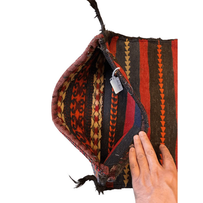 Antique Qashqai bag face 1900s, showing intact closures and worn nomadic rucksack straps from migration use