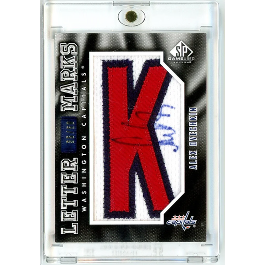 Red and white embroidered K patch with navy trim on 2010 SP Ovechkin relic auto card