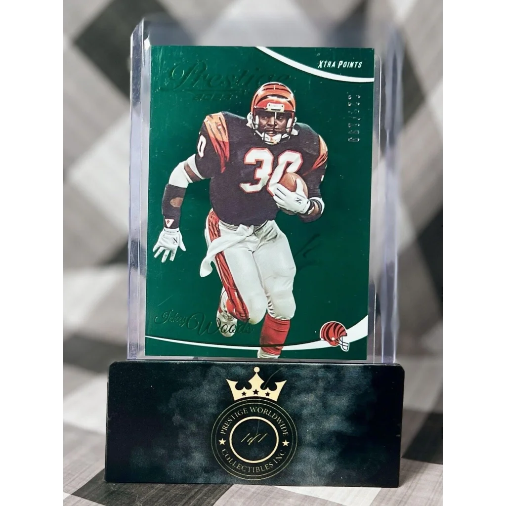 Green 2013 Panini Prestige Ickey Woods card on black acrylic stand