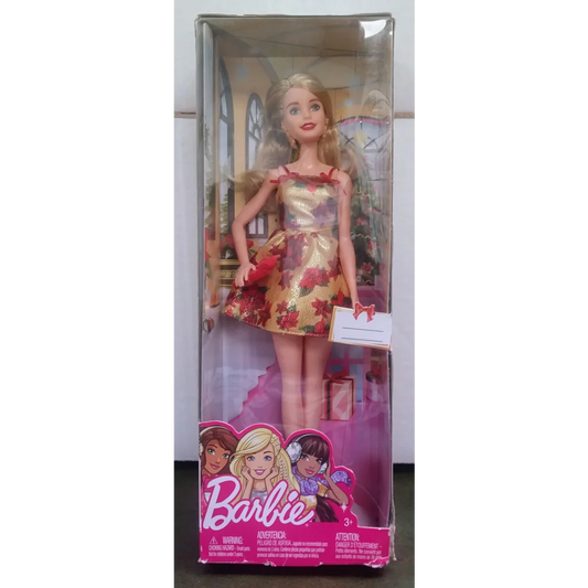 Holiday Barbie doll with blonde hair in gold red floral dress
