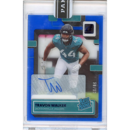 Blue Travon Walker football trading card with autograph, numbered 58/99, third party authentication