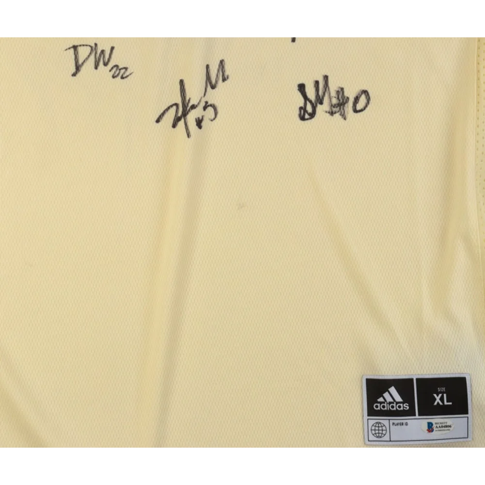 Light-colored Kansas Jayhawks team-signed jersey with stitched fabric and size tag