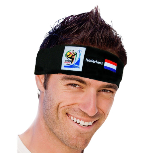 Man wearing black fabric headband with South Africa 2010 FIFA World Cup logo and Netherlands flag, smiling at camera against white background.