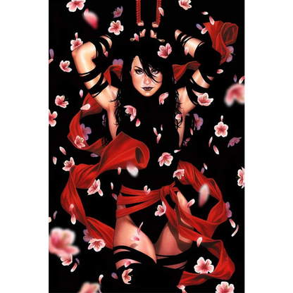 Woman with long dark hair in black outfit with red sashes and pink cherry blossoms