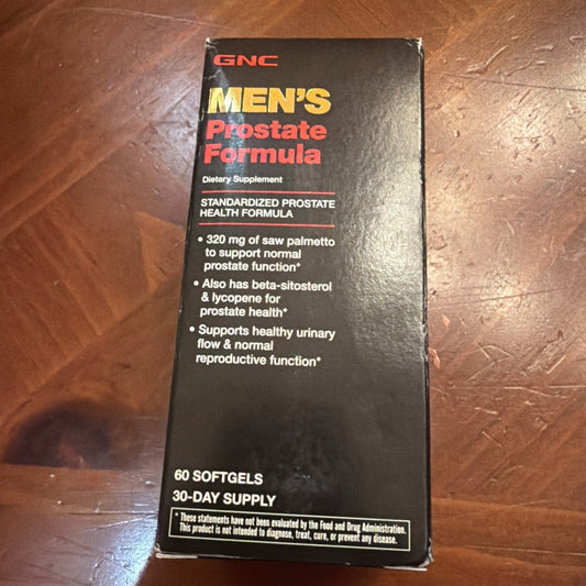 GNC Men's Prostate Formula black box packaging displayed front-facing on wooden surface, showing product details and ingredient information.