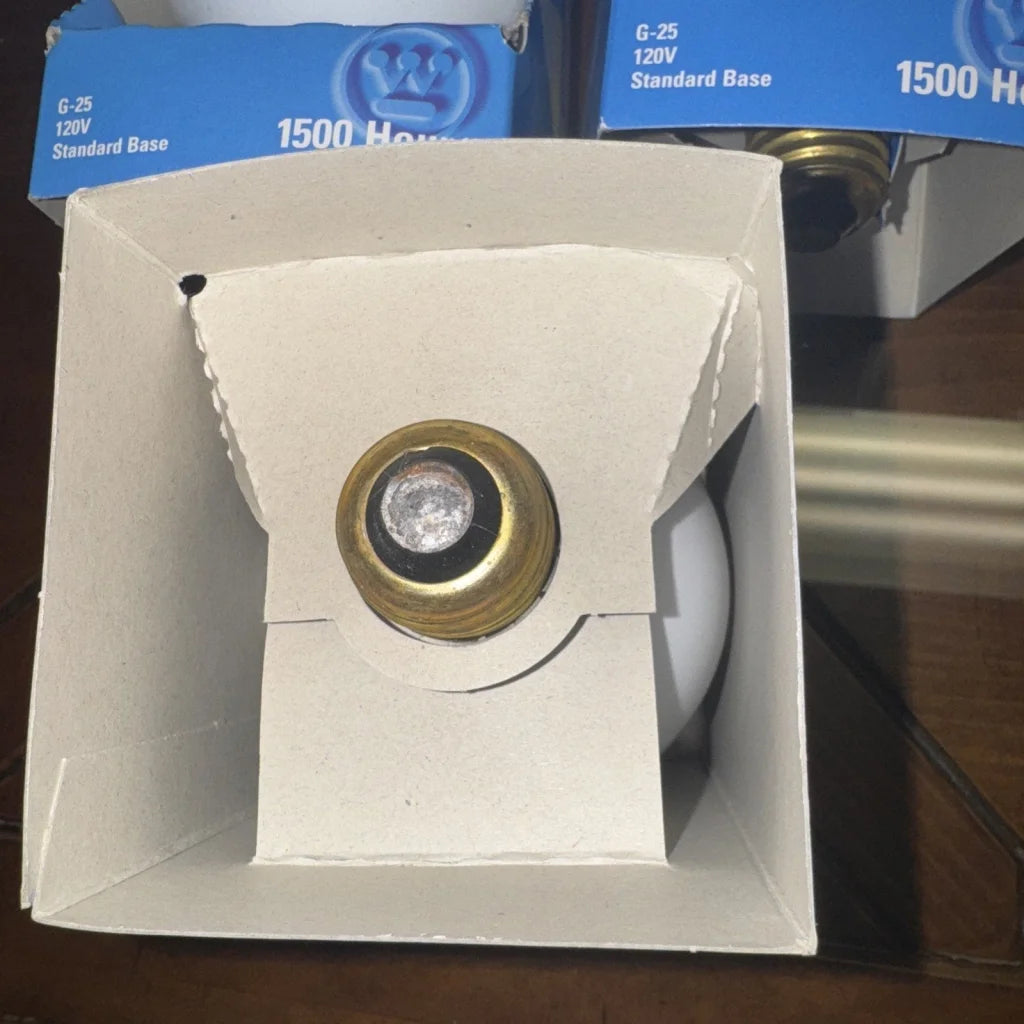 60 watt G25 light bulb with brass base in Westinghouse GE packaging