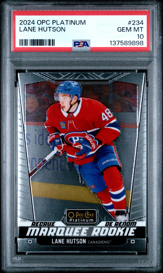 PSA-graded hockey card in protective case showing Lane Hutson in red Canadiens jersey against dark background with platinum branding.