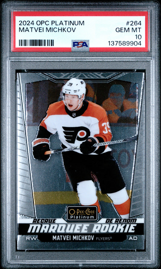 PSA-graded hockey card in clear plastic case displaying Matvei Michkov in orange, white and black Flyers uniform with white helmet.