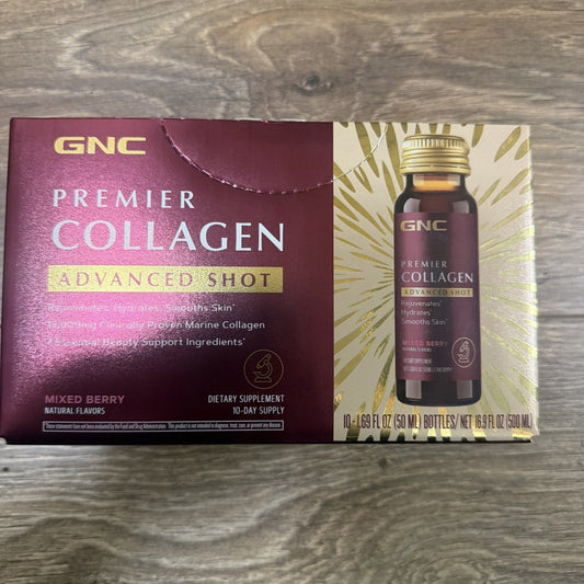 GNC Premier Collagen Advanced Shot box and bottle displayed flat on wooden surface, showing maroon packaging with gold accents and dark glass bottle.