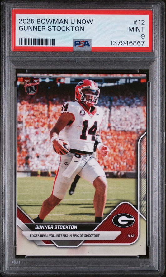 PSA-graded trading card in plastic holder displaying Gunner Stockton in Georgia Bulldogs uniform, number 14, running with football during stadium game.