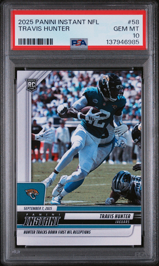 PSA graded rookie card in clear plastic case showing Travis Hunter in Jaguars uniform catching football, with red grading label and GEM MT 10 rating visible.