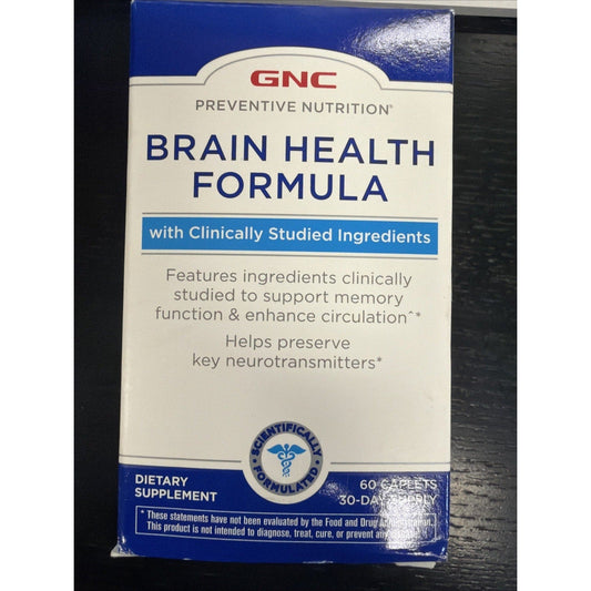 GNC Preventive Nutrition Brain Health Formula blue and white supplement box displayed front-facing on dark wooden surface.