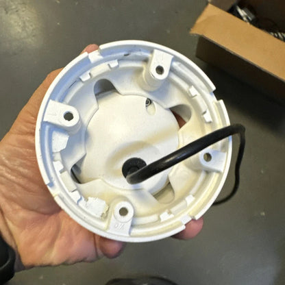 Back of 4Analog HD 1080P CCTV camera with white plastic circular base and black wire
