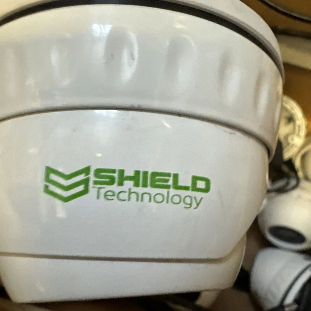 White ceramic CCTV dome camera with green shield logo, HD 1080P 4-in-1