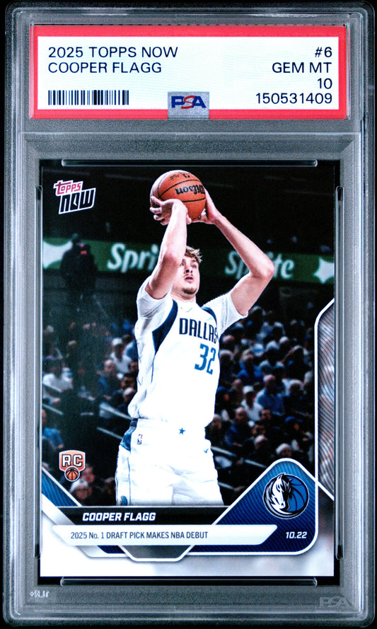 PSA-graded rookie card in clear plastic case showing Cooper Flagg in white Dallas Mavericks jersey shooting basketball, with red label and certification details visible.
