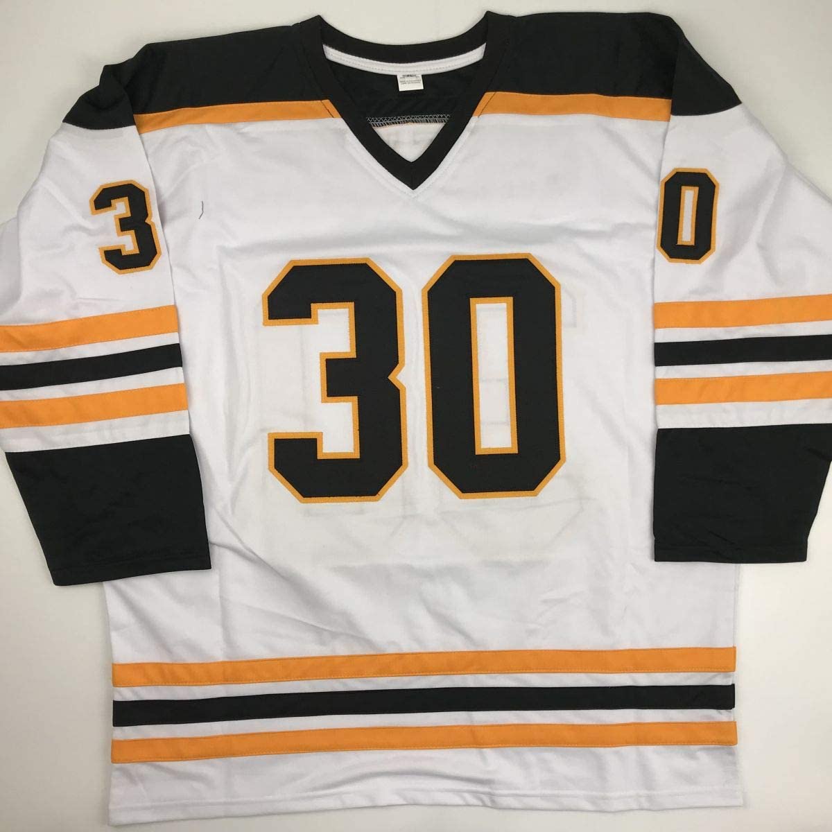 White Boston Bruins hockey jersey number 30 with black and orange trim, displayed flat against gray background.